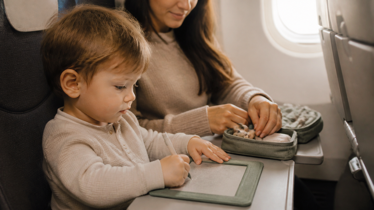 Toddler entertained with quiet activities during a flight